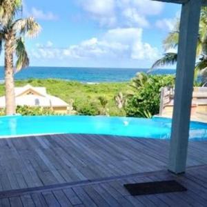 Villa with 4 bedrooms in moule with wonderful sea view private pool enclosed garden 50 m from the beach Guadeloupe 