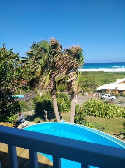 Villa de 4 chambres a Moule a 50 m de la plage avec vue sur la mer piscine privee et jardin clos - image 11