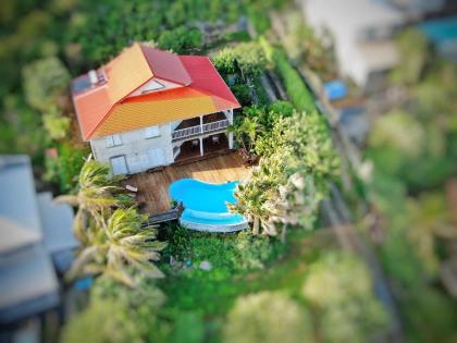 Villa de 4 chambres a Moule a 50 m de la plage avec vue sur la mer piscine privee et jardin clos - image 16