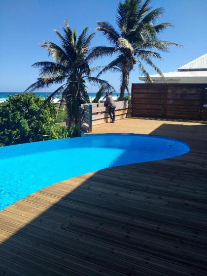 Villa de 4 chambres a Moule a 50 m de la plage avec vue sur la mer piscine privee et jardin clos - image 9
