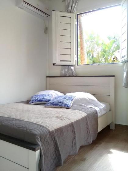 Bungalow d'une chambre avec piscine partagee jardin clos et wifi a Le Gosier - image 9