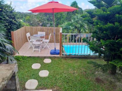Bungalow d'une chambre avec piscine partagee jardin clos et wifi a Le Gosier a 2 km de la plage - image 1
