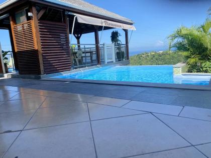 Bungalow de 2 chambres avec vue sur la mer piscine partagee et jardin clos a Vieux Habitants a 6 km de la plage - image 19