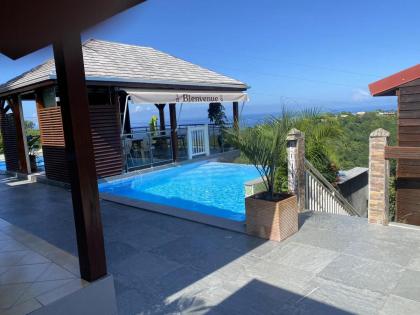 Bungalow de 2 chambres avec vue sur la mer piscine partagee et jardin clos a Vieux Habitants a 6 km de la plage - image 9